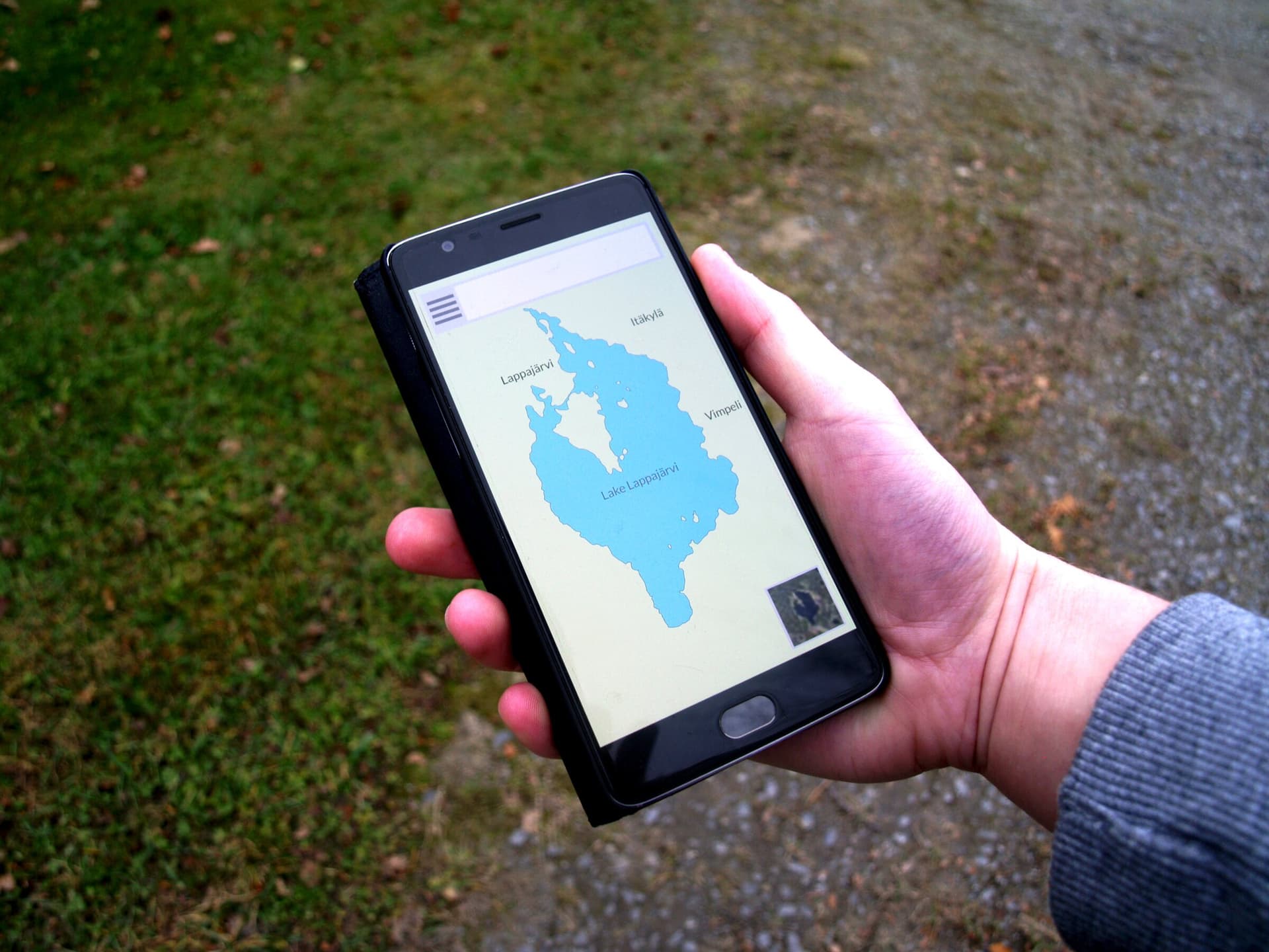 Manager checking a mobile application in the field