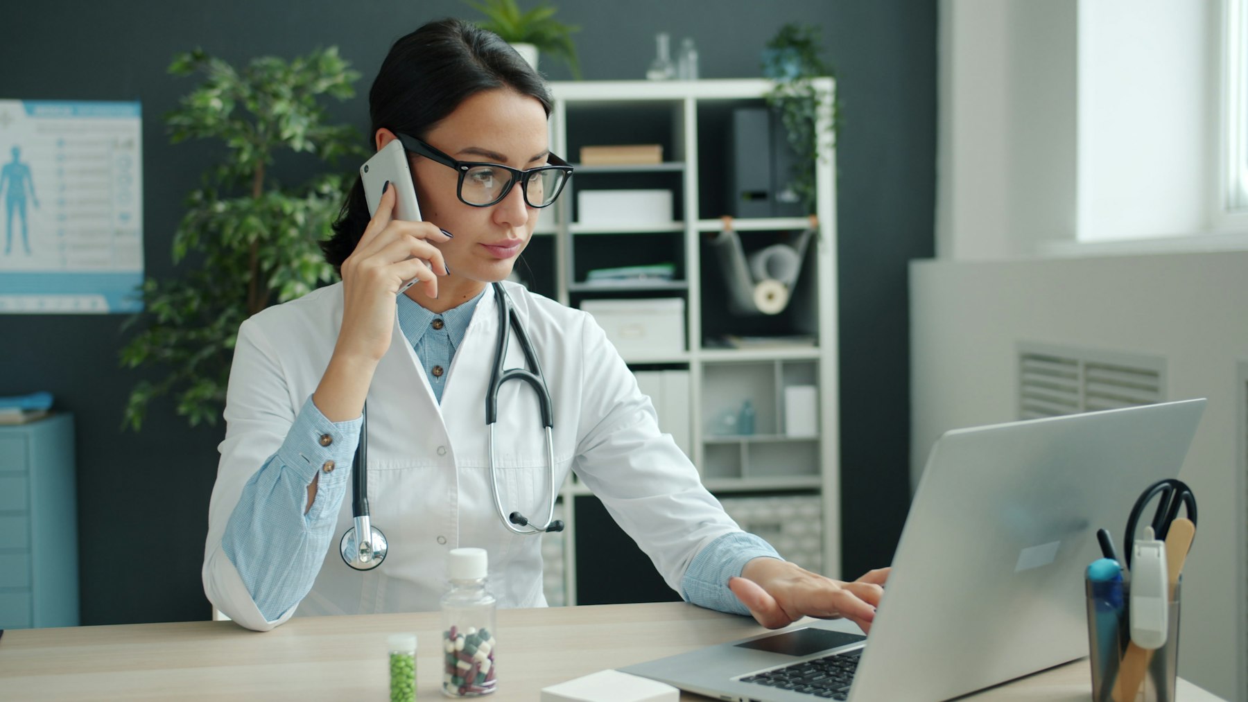 Doctor at a workstation to illustrate custom medical software